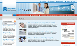 Computerbildschirm zeigt Webseite mit Text und Bildern, hauptsächlich weißer Hintergrund, blaue Akzente